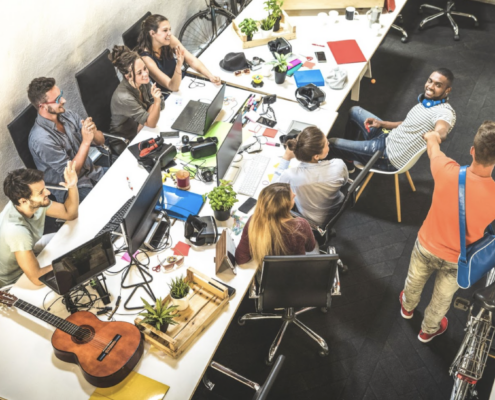 team working together hand in hand in a room